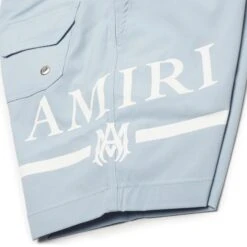 Amiri Kids MA Bar Dusty Blue Swim Trunks -Creps Lockers amiri kids ma bar dusty blue swim trunks pf22kjb002 420 logo