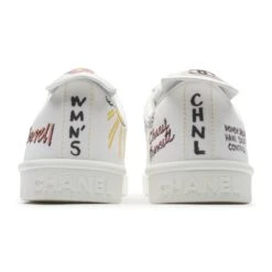 Chanel X Pharrell White Canvas Sneaker 9 Chanel X Pharrell White Canvas Sneaker -Creps Lockers chanel x pharrell white canvas sneaker backj