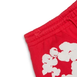 Denim Tears The Cotton Wreath Red Sweatpants 9 Denim Tears The Cotton Wreath Red Sweatpants -Creps Lockers denim tears the cotton wreath red sweatpants corner detail