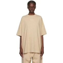 Fear Of God Essentials Gold Heather T Shirt (FW23) -Creps Lockers fear of god essentials gold heather t shirt fw23 125bt232003f model front