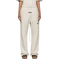Fear Of God Essentials Relaxed Light Oatmeal Sweatpants (SS22) -Creps Lockers fear of god essentials relaxed light oatmeal sweatpants ss22 model front