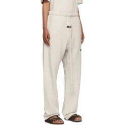 Fear Of God Essentials Relaxed Light Oatmeal Sweatpants (SS22) -Creps Lockers fear of god essentials relaxed light oatmeal sweatpants ss22 model side