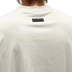 Fear Of God Essentials Silver Cloud T Shirt (FW23) -Creps Lockers fear of god essentials silver cloud t shirt fw23 model detail