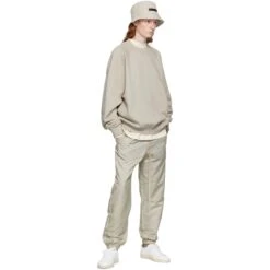 Fear Of God Essentials Smoke Track Pants (FW22) -Creps Lockers fear of god essentials smoke track pants fw22 130su222161f model