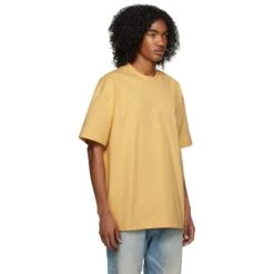 Fear Of God Essentials SS Light Tuscan T Shirt (SS23) 7 Fear Of God Essentials SS Light Tuscan T Shirt (SS23) -Creps Lockers fear of god essentials ss light tuscan t shirt ss23 model side